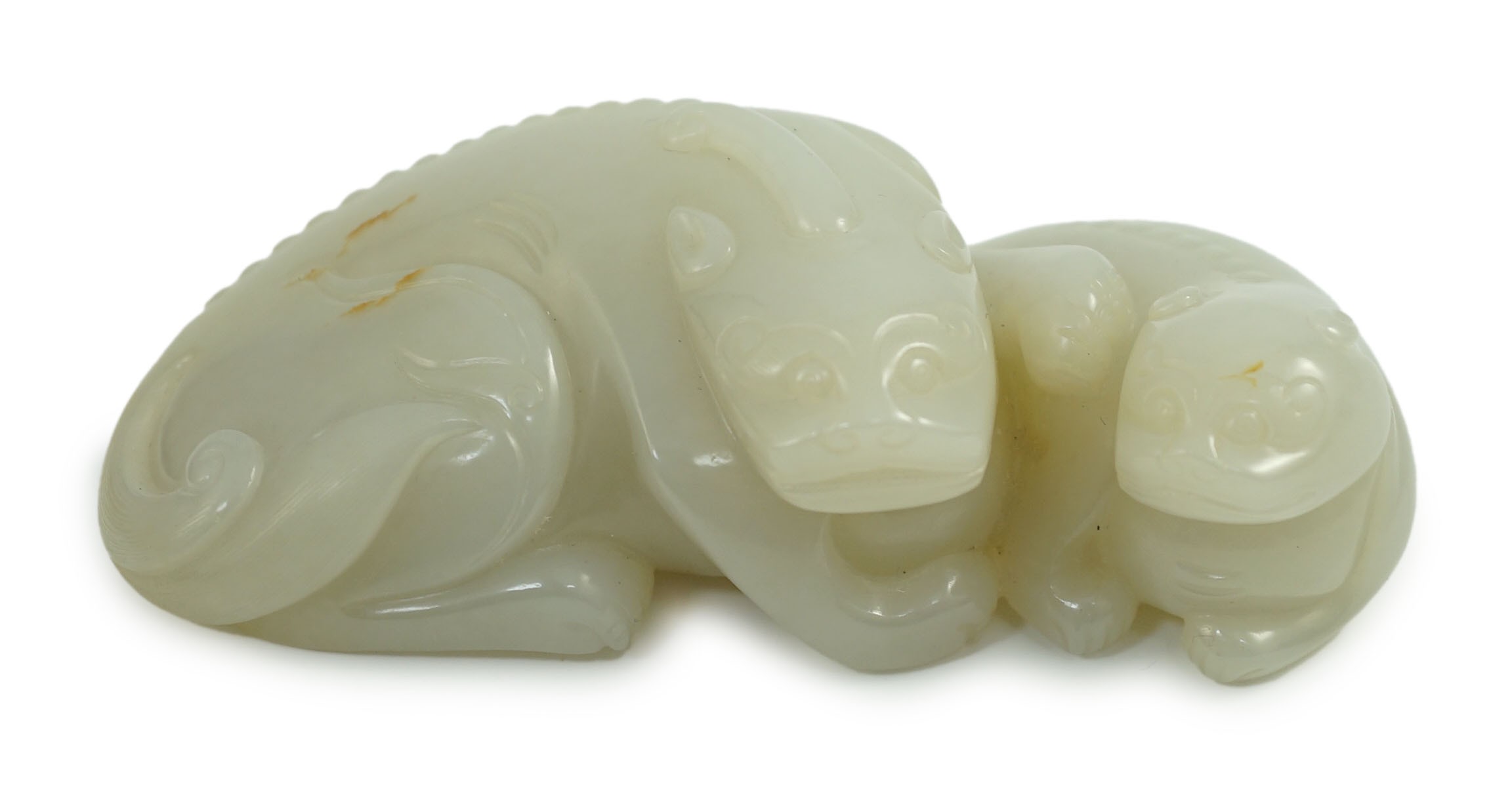 A Chinese white jade mythical beast group, 12cm long